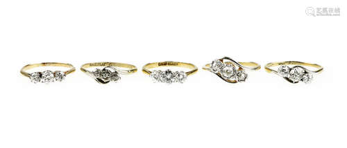 A collection of three-stone diamond rings