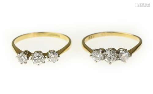 Two three-stone diamond rings