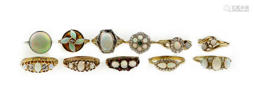 A collection of opal and diamond rings