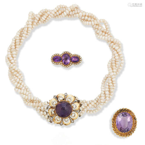 An amethyst and freshwater pearl necklace and two amethyst brooches