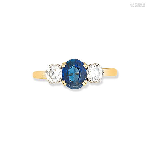 A three-stone sapphire and diamond ring