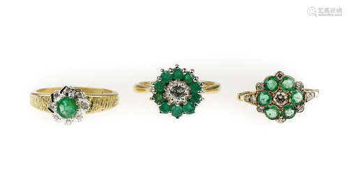 Three emerald and diamond cluster rings