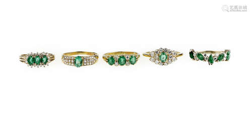 A collection of emerald and diamond rings