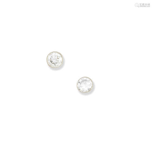 A pair of diamond stud earrings