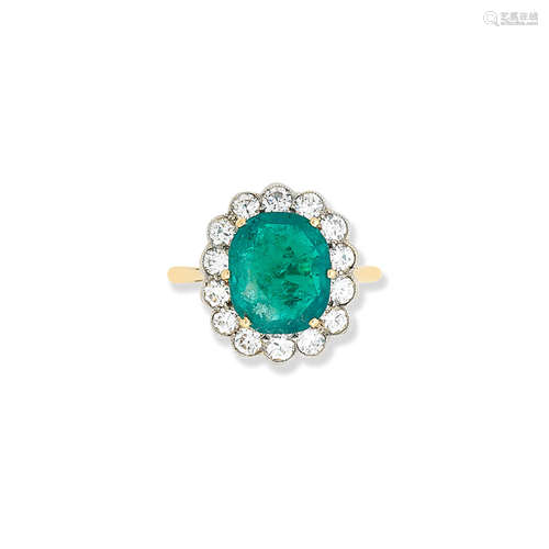 An emerald and diamond cluster ring, retailed by Carrington & Co. Ltd.