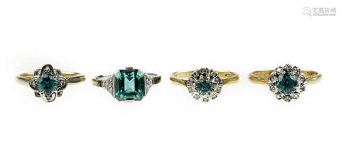 A collection of blue zircon and diamond rings