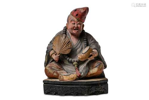 A CHINESE POLYCHROMED WOOD FIGURE OF JI GONG.