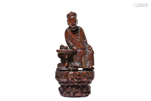 A CHINESE CANTON HARDWOOD FIGURE OF A SCHOLAR.