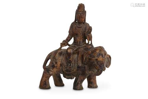 A CHINESE HARDWOOD FIGURE OF GUANYIN ON AN ELEPHANT.