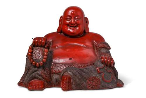 A CHINESE CINNABAR LACQUER FIGURE OF BUDAI HESHANG.