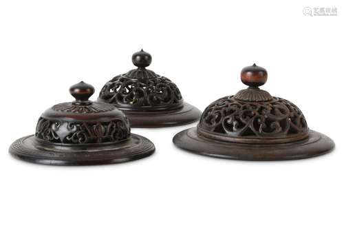 THREE CHINESE WOOD JAR COVERS.