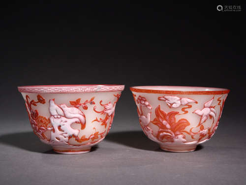 A PAIR OF  OVERLAY DECORATED RED GLASS ‘FLOWER AND BIRD’ CUPS, QING DYNASTY