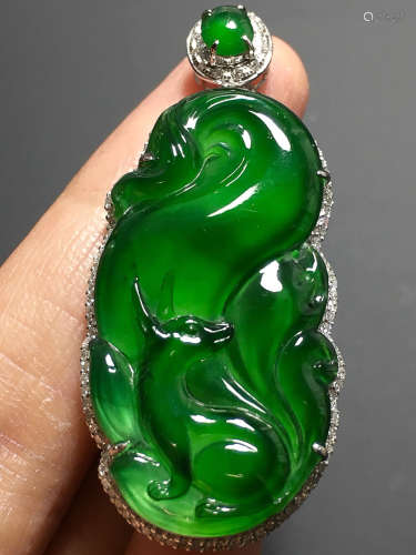 A TRANSLUCENT JADEITE ZHENGYANG GREEN FOX PENDANT