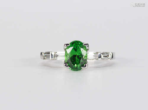 Tsavorite, diamond and 14k white gold ring Centering (1) oval-cut tsavorite garnet, weighing