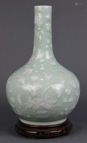 Chinese slip decorated celadon porcelain vase, having a cylindrical neck and globular body with