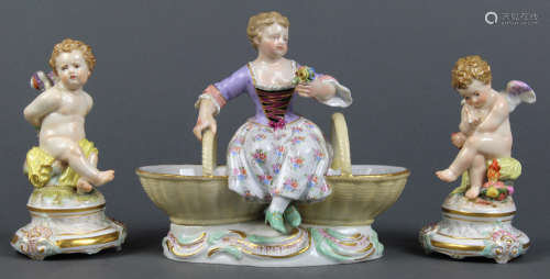 (lot of 3) Meissen figural groups, two depicting putti with legs crossed, and rising on a