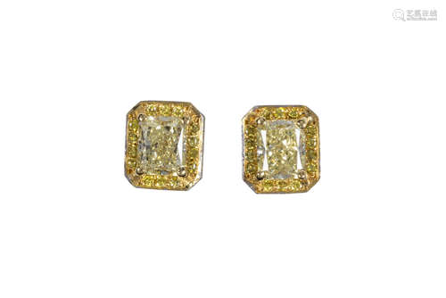 Pair of diamond and 18k white gold earrings Centering (1) radiant-cut diamond, weighing 1.06 cts.,