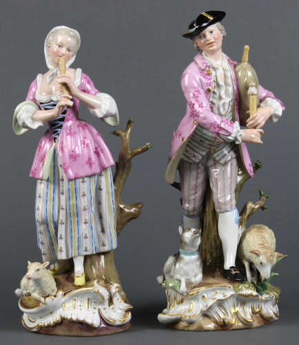 (lot of 2) Meissen porcelain figural groups, each playing an instrument, dressed in period attire