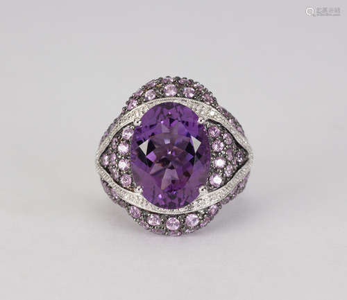 Amethyst, sapphire, diamond and 14k white gold ring Featuring (1) oval-cut amethyst, weighing