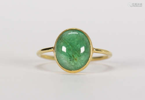 Emerald and 18k yellow gold ring Featuring (1) oval emerald cabochon, measuring approximately 10 X 8