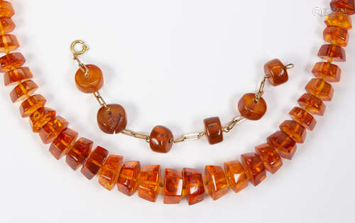 Amber and 14k yellow gold jewelry suite Including 1) necklace, composed of numerous faceted