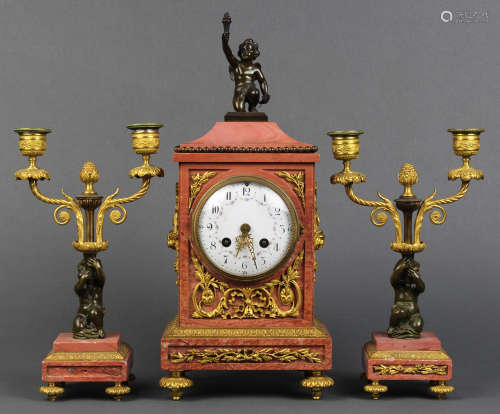 French clock and garniture, the clock having an agate case with ormolu mounts surmounted by the