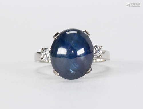 Sapphire, diamond and 18k white gold ring Featuring (1) oval sapphire cabochon, weighing 8.45