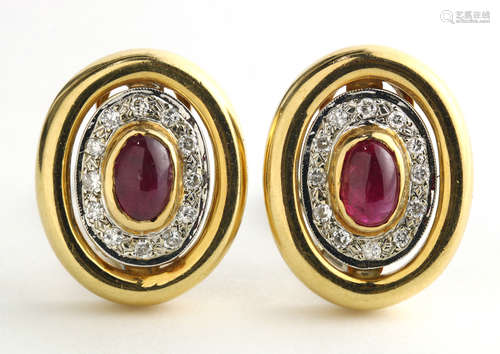 Pair of ruby, diamond and 14k yellow gold earrings Centering (2) oval ruby cabochons, measuring