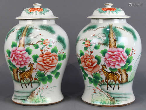 Pair of Chinese porcelain lidded jars, the body decorated with a deer, peonies, and a crane