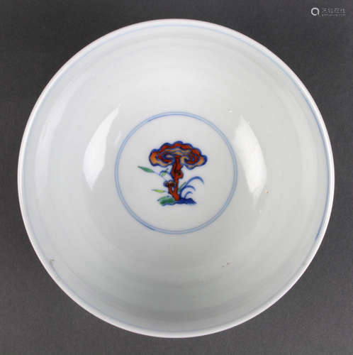 Chinese doucai porcelain bowl, the exterior with stylized lotus bands amid tendrils, below a