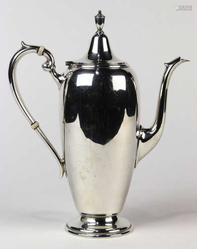 Gorham sterling silver coffee pot, the hinged lid with an urn form finial, above the elongated