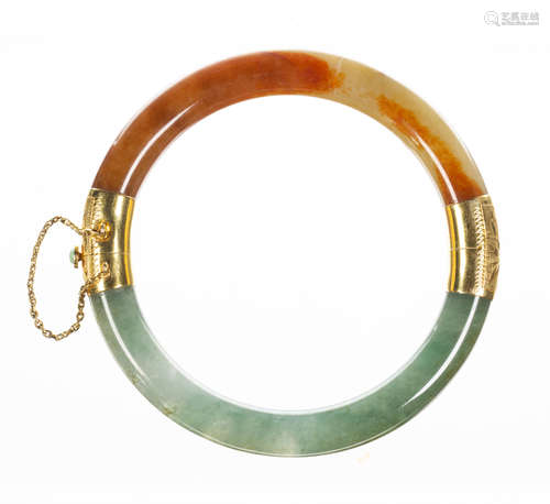 Jadeite and 14k yellow gold bracelet Featuring (2) carved jadeite segments, measuring