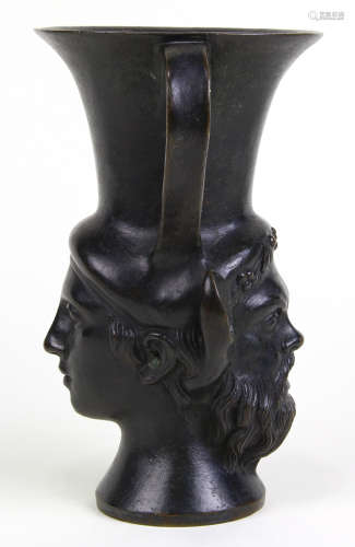 Patinated bronze handled vessel after the antique, the trumpet form with mythological medallions