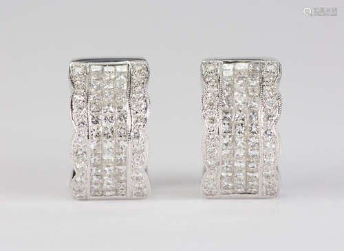 Pair of diamond and 18k white gold earrings Featuring (78) princess-cut diamonds, weighing a total