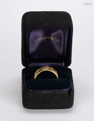 Tiffany & Co. Atlas 18k yellow gold ring The 18k yellow gold Atlas band, measures approximately 6.