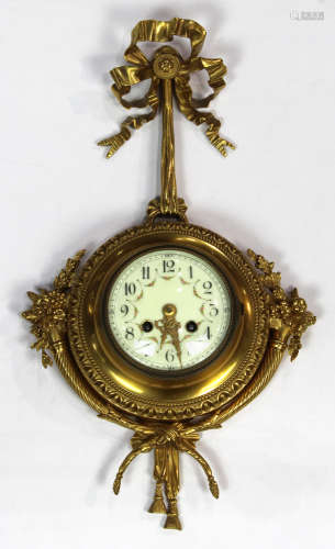 Continental ormolu clock, having a circular dial with Arabic markers, the case surmounted with a bow