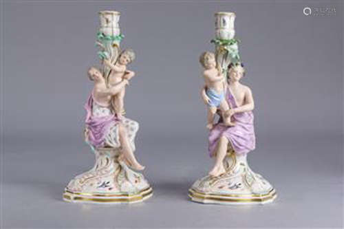 (lot of 2) Meissen figural candlestick group 19th century, each depicted holding a child, one figure