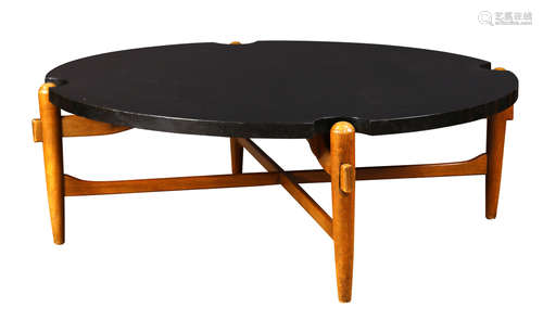 Mid Century cocktail table attributed to Greta Grossman circa 1950, having a laminate circular top