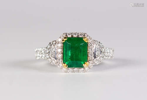 Emerald, diamond, 18k yellow and white gold ring Centering (1) emerald-cut emerald, weighing 1.45