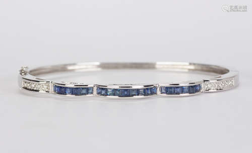 Sapphire, diamond and 14k white gold bracelet Featuring (23) square-cut sapphires, weighing a