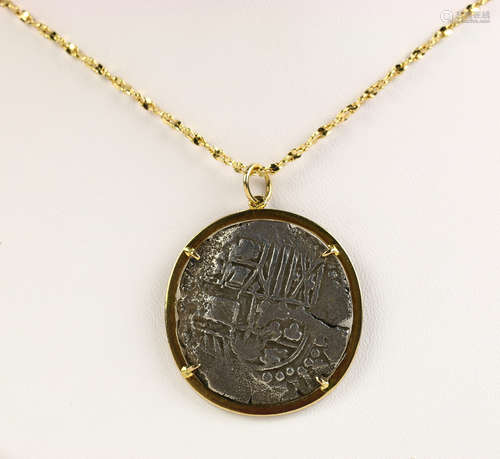 Coin form, 14k yellow gold pendant-necklace Featuring (1) silver coin form, measuring