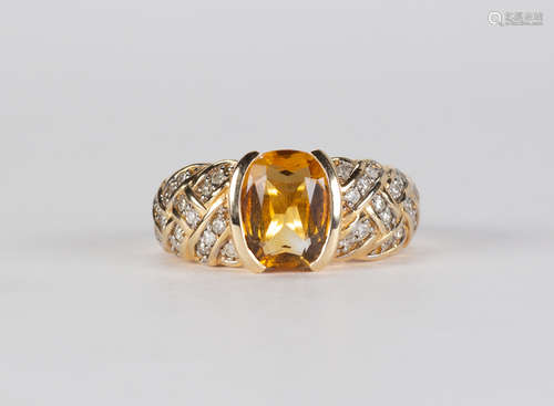 Citrine, diamond and 14k yellow gold ring Featuring (1) oval-cut citrine, weighing approximately 2.