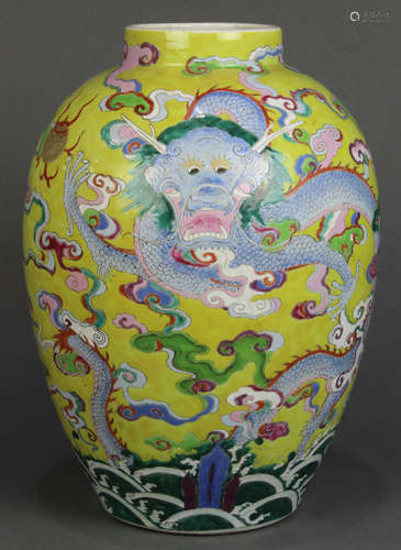 Chinese enameled porcelain jar, the tapering ovoid body featuring a meandering blue dragon on a