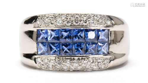 Sapphire, diamond and platinum ring Featuring (12) French-cut sapphires, weighing a total of