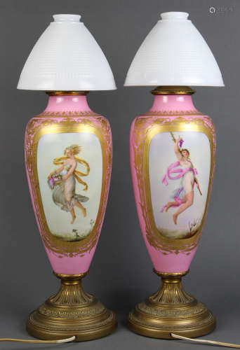 Pair of German porcelain lamps, each shouldered standard with a partial gilt pink ground, centered