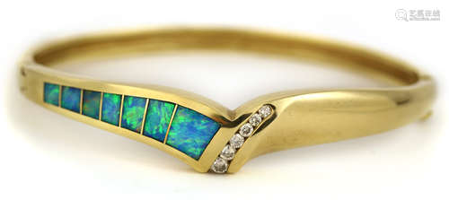 Opal, diamond and 14k yellow gold bracelet Featuring (7) opal inlaid segments, accented by (6)