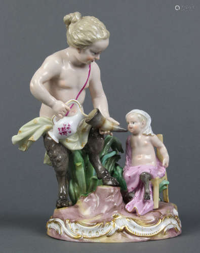 Meissen figural group, depicting a satyr feeding its young, the whole resting on a naturalistic