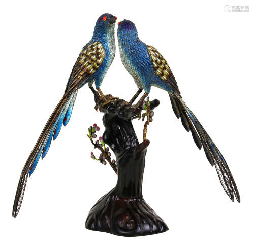 Continental silver and enamel decorated bird form figures, having red coral eyes with colorful