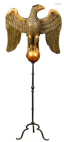 German Baroque style gray painted and parcel-gilt wooden eagle, 18th century, the head in profile