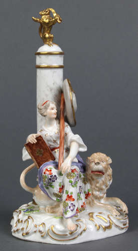Meissen figural group, depicting a beauty sitting beneath a cylindrical spire, with a book, staff